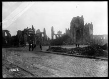 Soldiers walk among the ruins in the town of Ypres, Belgium, 1917.